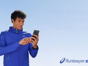 A male runner looking at his running training app on his phone