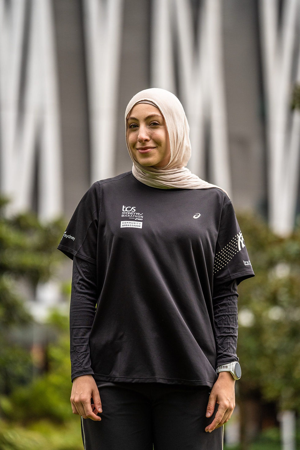 Woman in hijab wearing TCS Sydney Marathon running gear