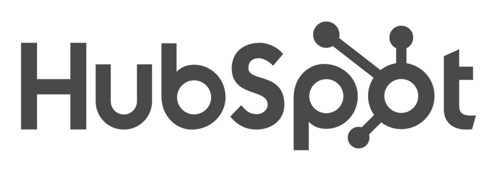HubSpot logo in gray on a black background